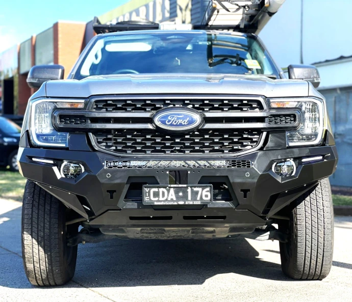 Front view of ArmorMan RoadMaster bullbar on Ford Ranger showing winch compatibility and integrated sensor locations.