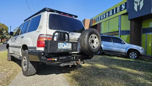 [AM-RCB-LC100-9807BM] BUSHMASTER REAR CARRIER BAR- LC100